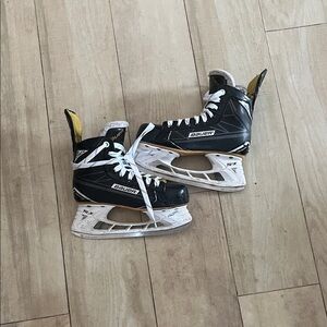 Bauer Black White Hockey Skates with Yellow Accent